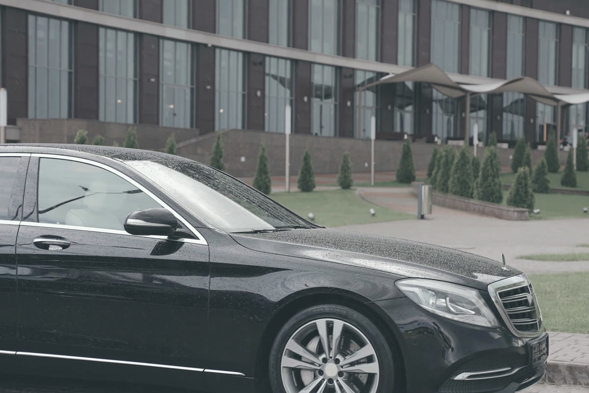 Executive saloon waiting outside a corporate building
